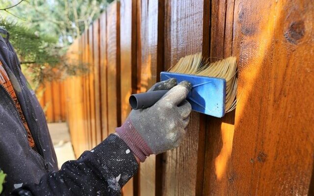 close-up-on-stack-of-rough-sawn-timber-pine-lumber-planks-construction-material